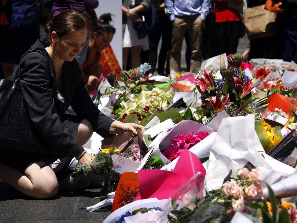 Homenagem às vítimas do sequestro em Sidney (Reuters)