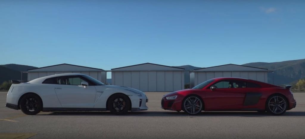 Drag race entre Nissan GT-R e Audi R8 (reprodução «Coches.net»)