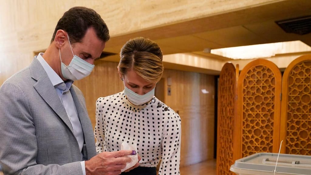 Bashar al-Assad e a mulher Asma