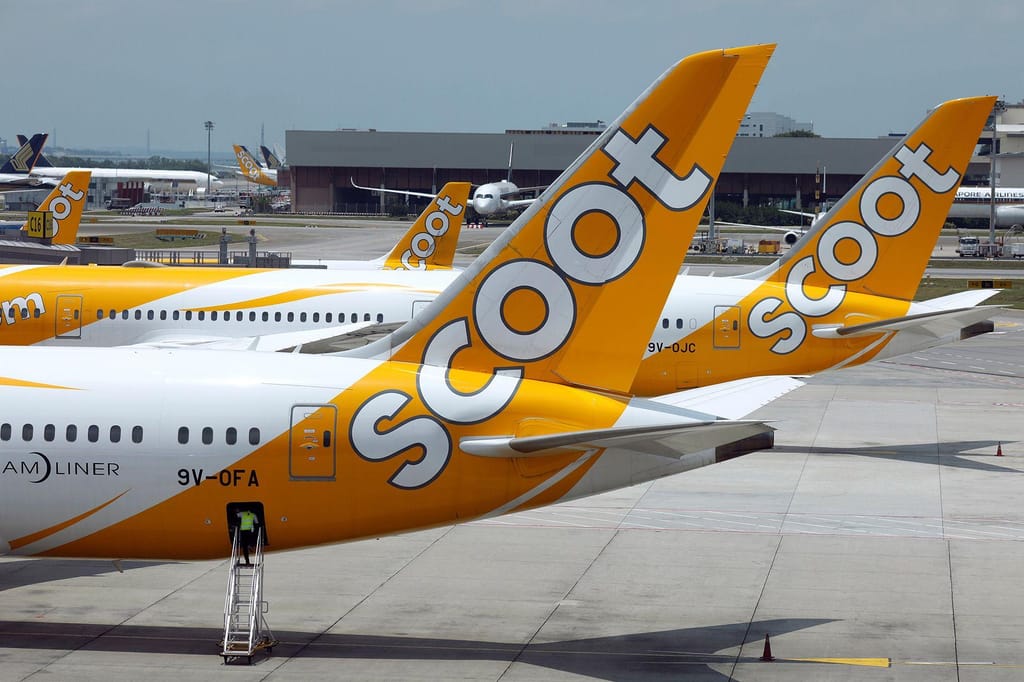 Aviões da Scoot na pista do aeroporto de Changi, em Singapura (CNN)